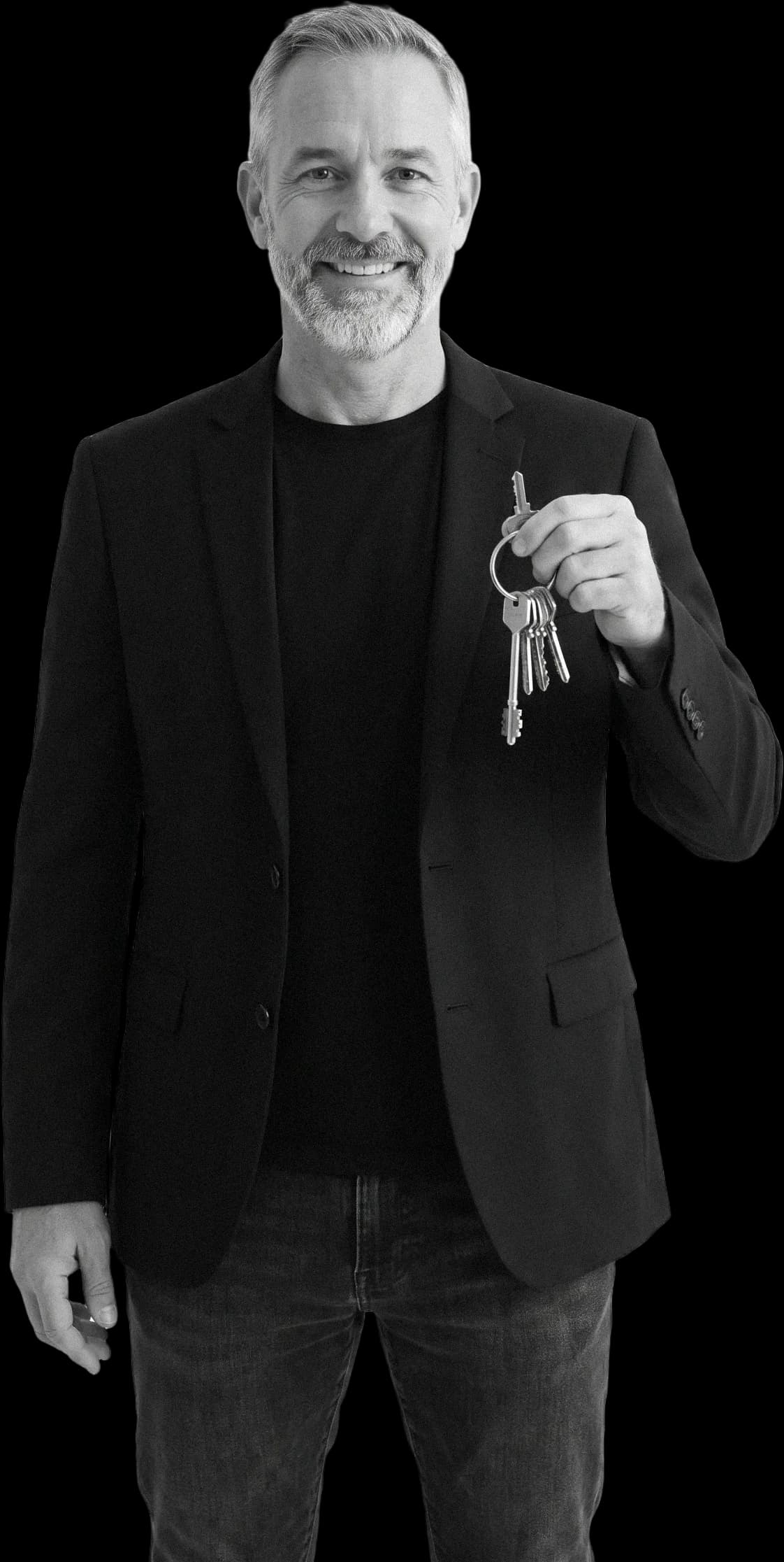 A real estate agent holding up keys, smiling